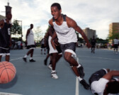 Basketball player in tournament at Harold Ickes Homes housing project, Chicago, Illinois, 2000